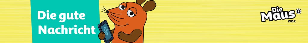 Die Mausfigur aus der Sendung mit der Maus hat ein Handy in der HAnd und steht vor einem Schild mit der Aufschrift 